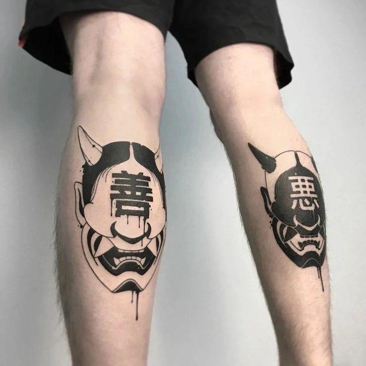 黑灰色的两个般若上面写着善和恶纹身图案